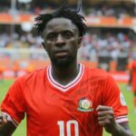 In their first African Nations Championship match, Kenya defeats two-time winners DR Congo 1-0, setting a new record.